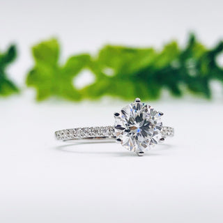 round-cut-solitaire-pave-moissanite-engagement-ring