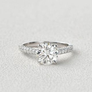 round-cut-solitaire-pave-moissanite-engagement-ring