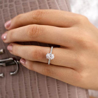 oval-shaped-moissanite-solitaire-with-pave-setting-engagement-ring