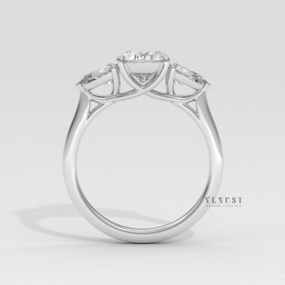 classic oval center pear side engagement ring
