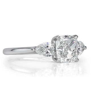 cushion cut three stone engagement ring