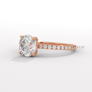 delicate round pavé engagement ring