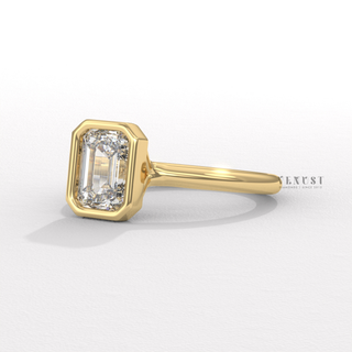 emerald bezel moissanite engagement ring
