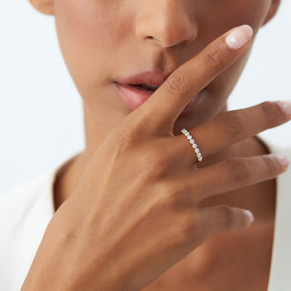 Round Moissanite Diamond Shared Prong Wedding Band in Gold