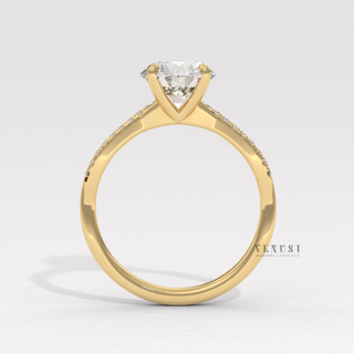 infinity engagement ring with round cut diamond