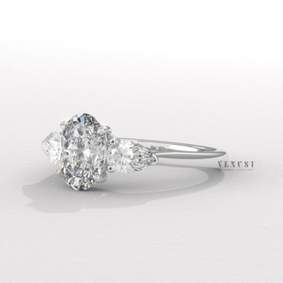 oval and pear diamond engagement ring