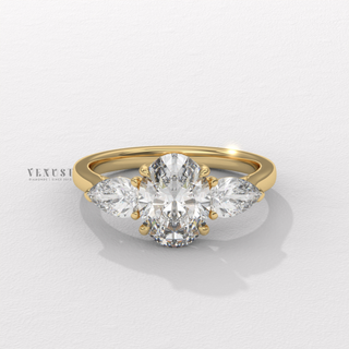 oval diamond three stone ring with pear side stones
oval cut engagement ring with pear side diamonds
oval center pear side stone engagement ring
oval solitaire with pear side stones