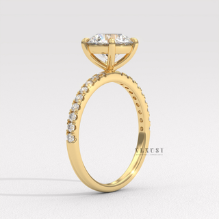round cut pavé engagement ring with side stones